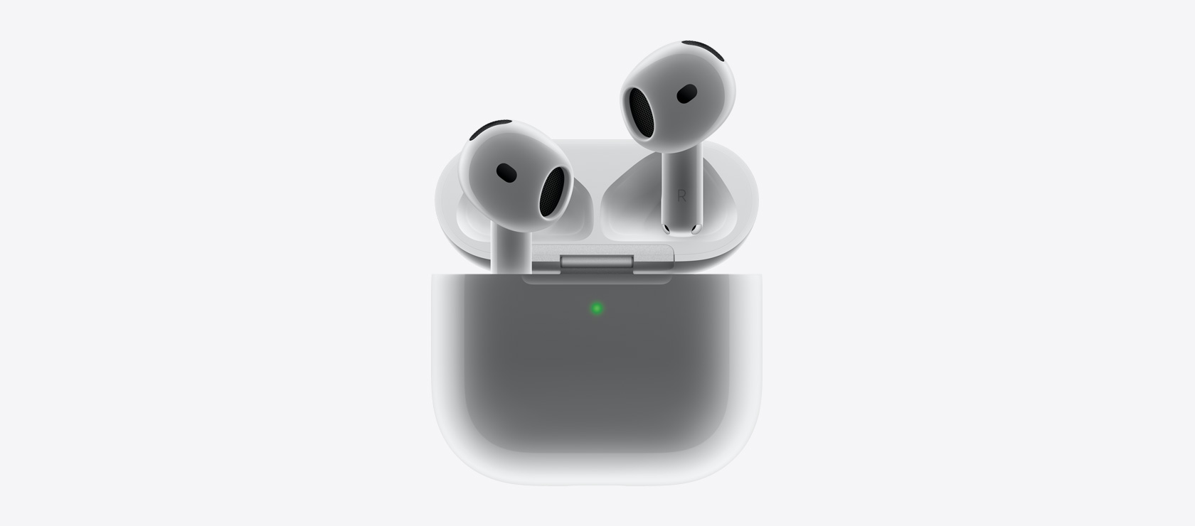 AirPods 4 kõrvaklapid oma laadimiskarpi asetumas.